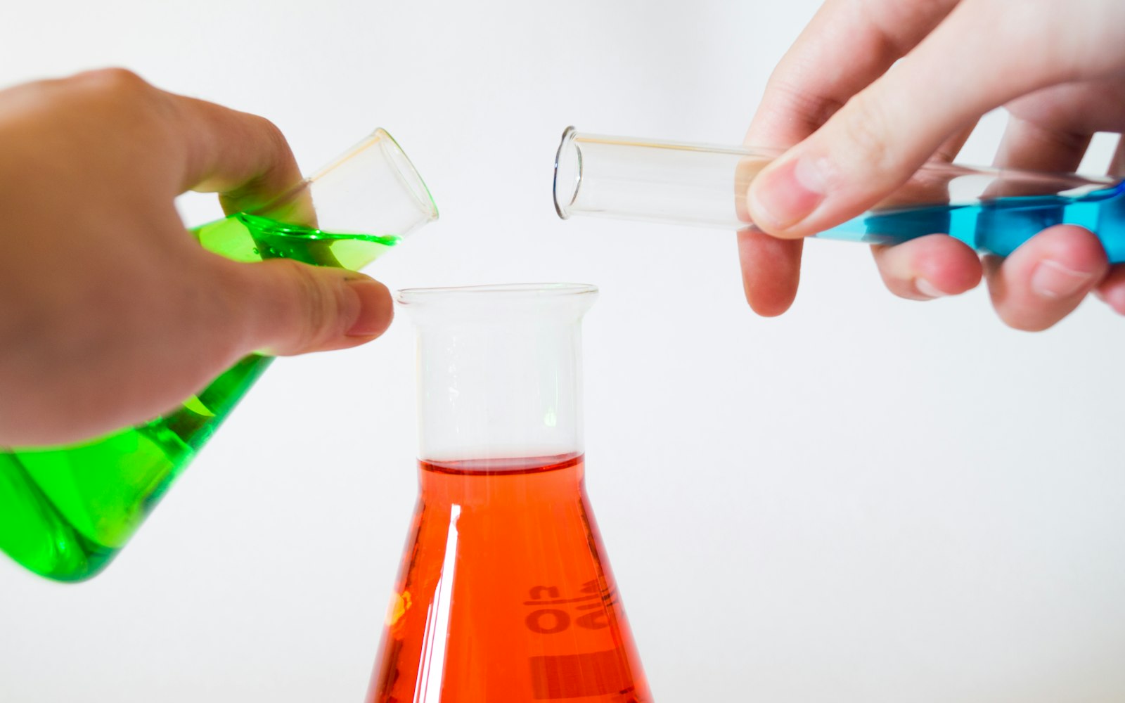 Chemists working with laboratory glassware at SM Chemical